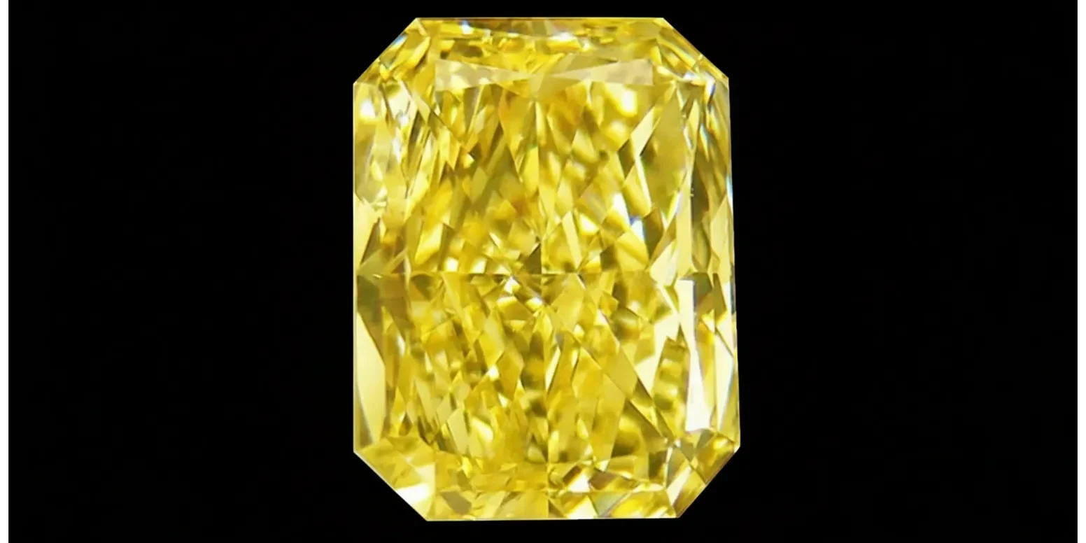 Close-up of a radiant yellow diamond against a black background.
