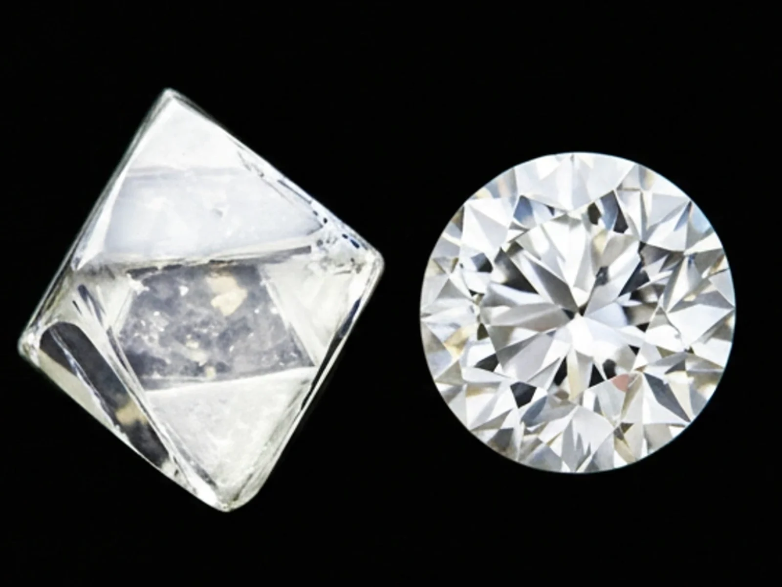 A sparkling emerald-cut diamond against a black background.