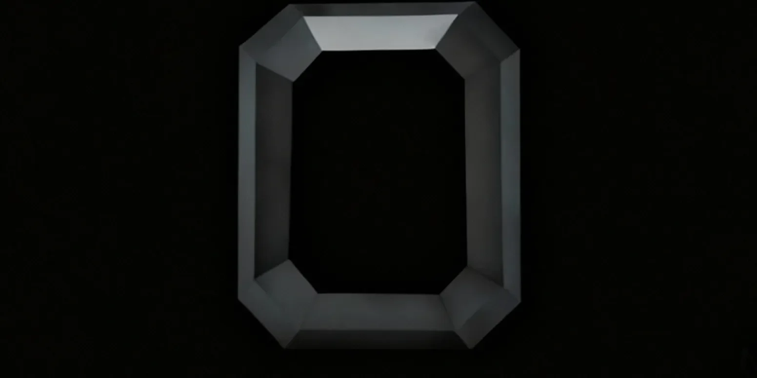 An emerald-cut black diamond against a black background.